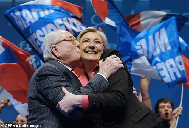 FILE PHOTO: French far-right party Front national (FN) President and candidate for the 2012 French presidential election, Marine Le Pen (R) is greeted by her father, FN honorary president, Jean-Marie Le Pen at the end of a campaign meeting on March 30, 2012 in Nice, southeastern France