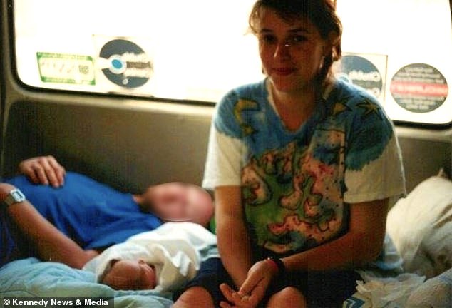 Jo was at the festival in Somerset with friends and the father of her child in 1989 when she began to experience cramps. Above: Jo in her van in Glastonbury with newborn Avalon