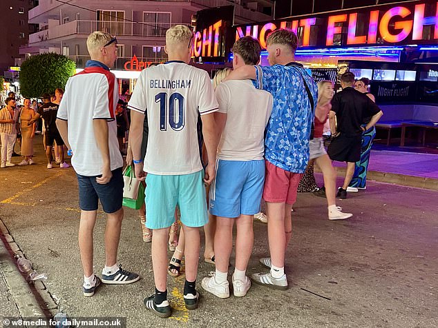 A fan is seen wearing a Bellingham strip after the England player scored the equaliser in Sunday night's match