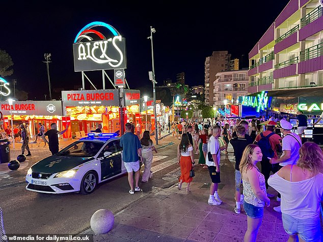 A police car which had its blue flashing lights on was seen on the strip last night as cops prepared for trouble from rowdy fans