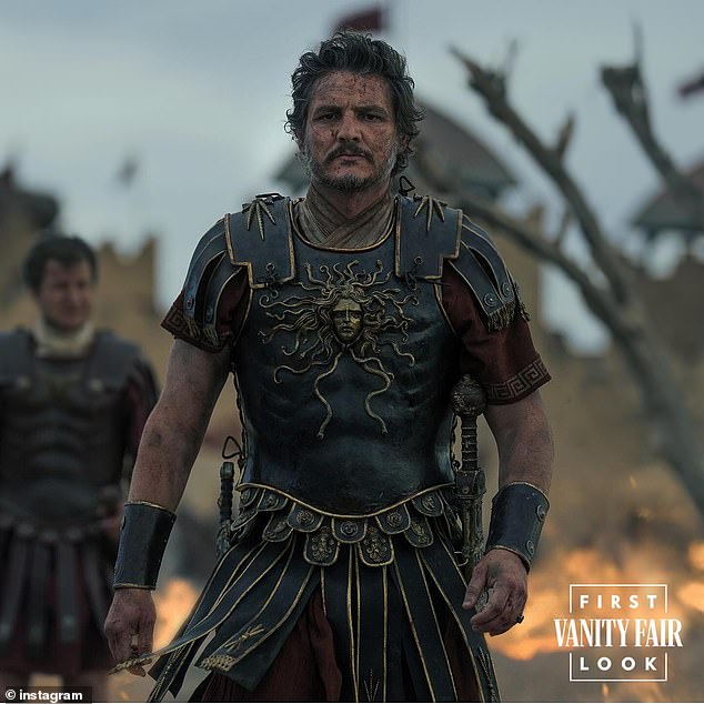 Paul went shirtless in one dramatic scene where he appeared to be preparing for battle before taking on blood soaked Pedro Pascal, 49 (pictured)