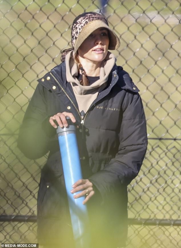 The former Miss Universe Australia winner appeared to get involved in the class when she was seen on the court and lending a hand by retrieving tennis balls with a pickup tube