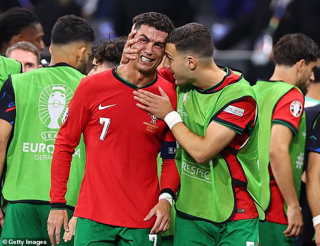 Ronaldo had to be consoled by his team-mates before the second half of extra time started