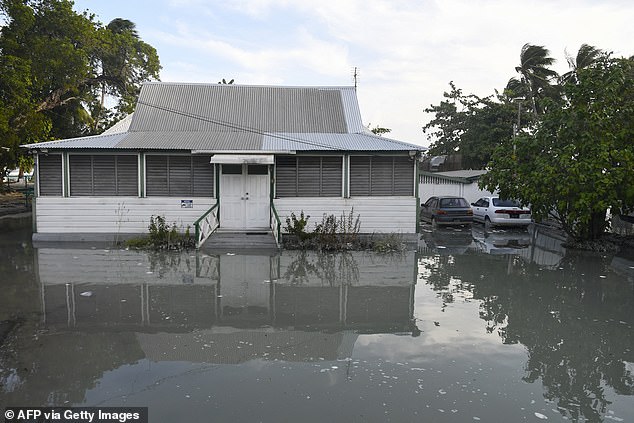 Flooded business are surrounded by water are seen after the passing of Hurricane Beryl in Worthing, Christ Church, Barbados on July 1, 2024