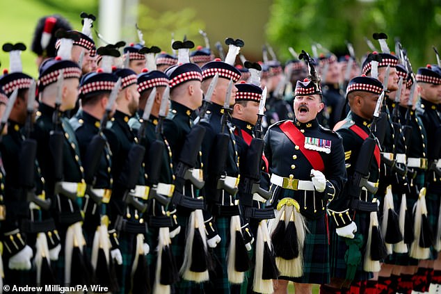 Soldiers move into position, ahead the Ceremony of the Keys on the forecourt of the Palace of Holyroodhouse today