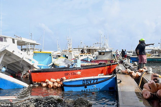 Beryl made landfall with devastating winds and storm surge, in Bridgetown port, Barbados on Monday, leaving behind a trail of destruction. Damaged bats are pictured at the port Tuesday