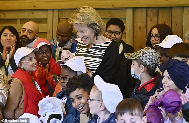 Hey! Queen Mathilde had a huge smile on her face as she went to Camp Tournesol to meet kids and engage in activities with them