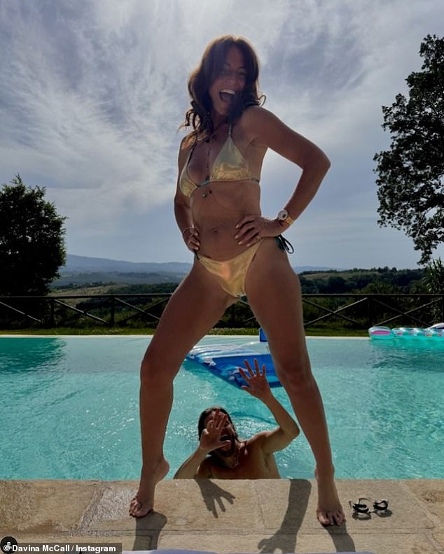 Davina McCall showed off her toned physique in a skimpy gold bikini as she posed by the pool in a new Instagram snap on Tuesday