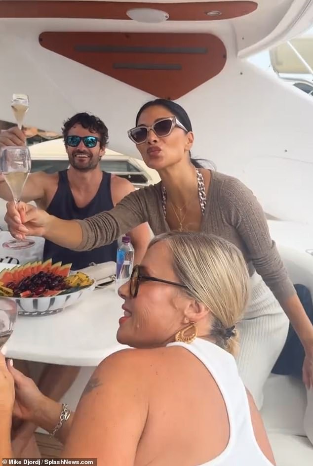 When they weren't showing off their dance moves, the couple enjoyed a glass of champange and a fruit bowl while relaxing with their pals