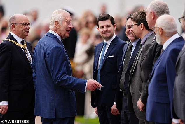 King Charles sharing a laugh with fans while next to Lord Provost Councillor Robert Aldridge