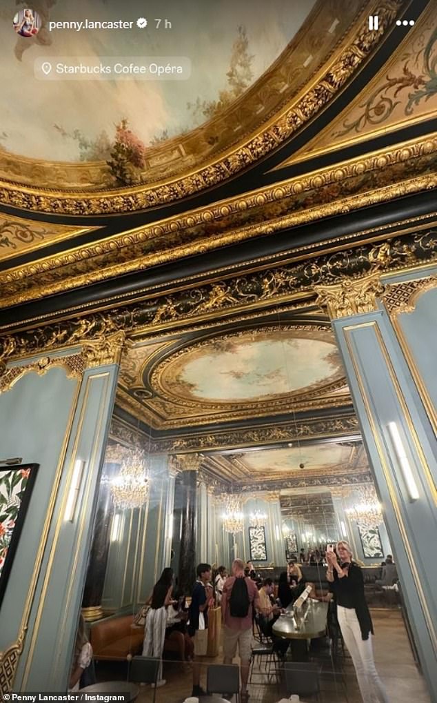 On Tuesday, Penny shared some more insight into their trip as she took a mirror selfie at a very fancy Starbucks in the French capital, complete with a gold-adorned baroque ceiling