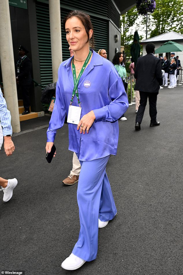 Laura Robson brought a pop of colour in a purple satin blouse and matching flares