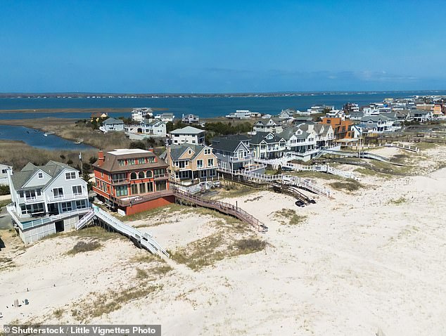 At least one summer spot in New York's elite East Hampton village, Havens Beach, has been closed due to fecal matter and bacterial concerns. Above, a sky view of a few Hamptons homes