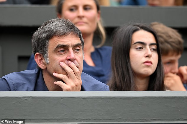 The snooker player, 48, looked transfixed as he watched alongside his daughter Lilly, 18, who he shares with ex Jo Langley