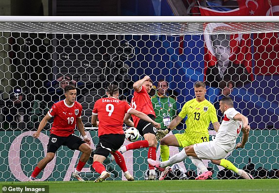 LEIPZIG, GERMANY - JULY 02: Merih Demiral of Turkiye scores his team's first goal during the UEFA EURO 2024 round of 16 match between Austria and Turkiye at Football Stadium Leipzig on July 02, 2024 in Leipzig, Germany. (Photo by Stu Forster/Getty Images)