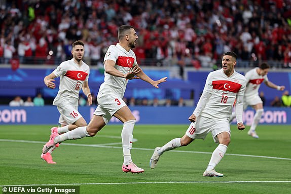 LEIPZIG, GERMANY - JULY 02: Merih Demiral of Turkiye celebrates scoring his team's first goal with teammate Mert Muldur during the UEFA EURO 2024 round of 16 match between Austria and Turkiye at Football Stadium Leipzig on July 02, 2024 in Leipzig, Germany. (Photo by Boris Streubel - UEFA/UEFA via Getty Images)