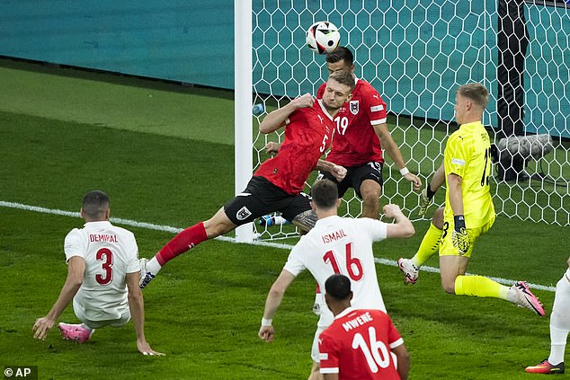 Demiral (left) netted from close range to give his side a 1-0 lead after 57 seconds - the fastest goal ever at the knockout stages of the European Championship