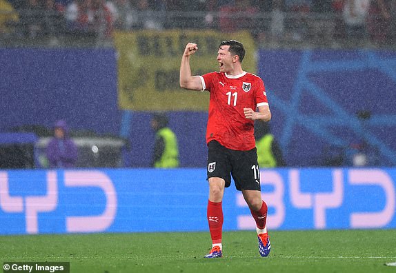 LEIPZIG, GERMANY - JULY 02: Michael Gregoritsch of Austria celebrates scoring his team's first goal during the UEFA EURO 2024 round of 16 match between Austria and Turkiye at Football Stadium Leipzig on July 02, 2024 in Leipzig, Germany. (Photo by Lars Baron/Getty Images)