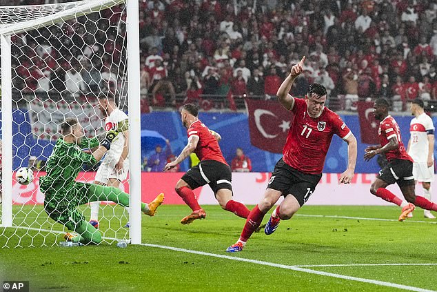 Austria pulled one back not long after with Michael Gergoritsch (R) tapping in at the back post