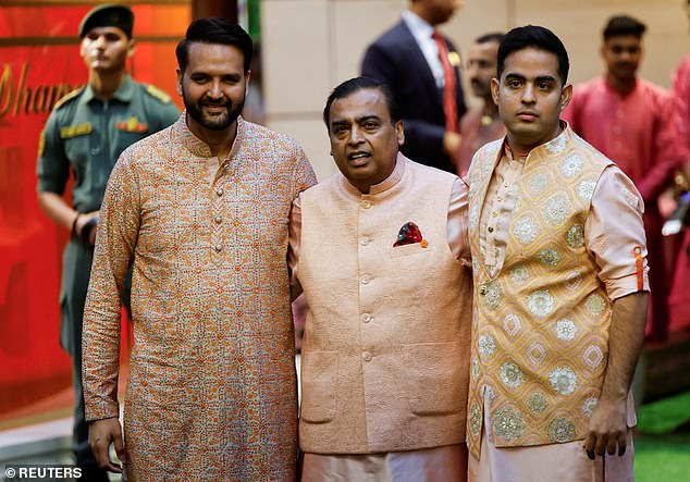 Mukesh Ambani (centre) poses with his son-in-law, Anand Piramal and son Akash Ambani (right), 32