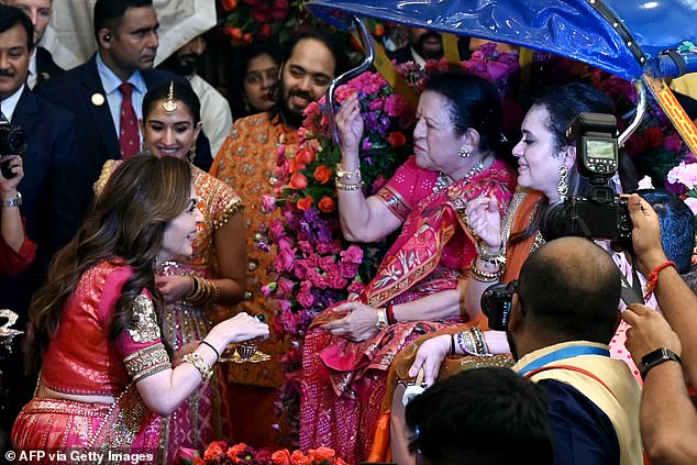 Nita Ambani, 60, greets guests during the traditional wedding ritual ahead of her son and Radhika's nuptials next weel