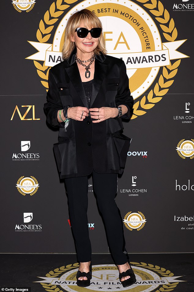 Lulu, 75, cut a chic figure as she hit the red carpet at the National Film Awards at London's Porchester Hall on Wednesday
