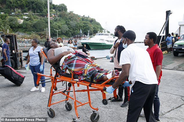 Members of the Red Cross transport a Union Island evacuee on a stretcher as she arrives in Kingstown, St. Vincent and the Grenadines, Wednesday, July 3, 2024. The island, in the Grenadines archipelago, was hit by Hurricane Beryl