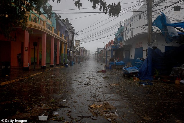 JAMAICA: An empty street as people remain indoors amid strong winds and lashing rain from Hurricane Beryl