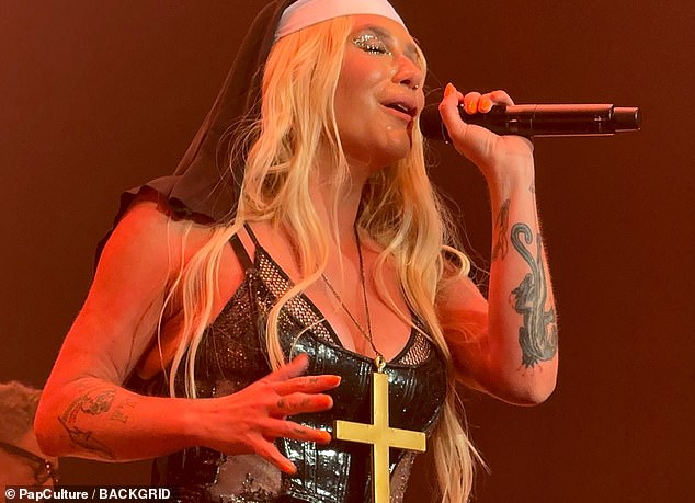 The star also switched up her outfits several times and proceeded to dress as a nun wearing a large gold cross necklace