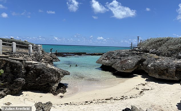 Julian loves the 'many paradise beaches to choose from for [his] morning walk and a dip', such as Shark Hole beach, seen above