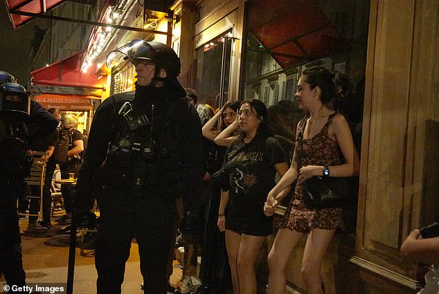 Young women trying to enjoy nights out in the city were forced to stand behind armoured cops