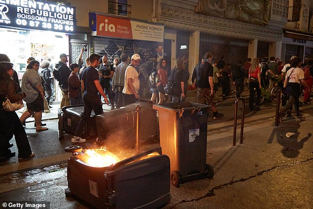 Bins were overturned and set alight, spreading acrid smoke into the air