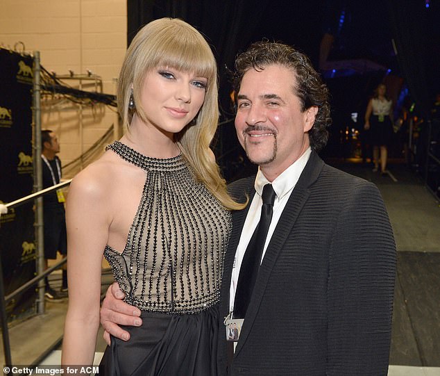 Swfit (left) and Scott Borchetta who acted as her manager when she signed with him aged 15