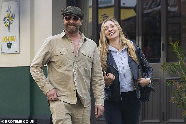 The actor, 54, put on a cosy display with Penny as they headed for lunch at the Queen's pub in Primrose Hill this week