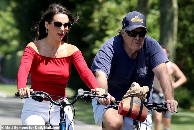 The ex-Patriots coach looked completely smitten with his 24-year-old girlfriend as the pair flashed matching rings on a holiday bike ride in Nantucket on the morning of Fourth of July