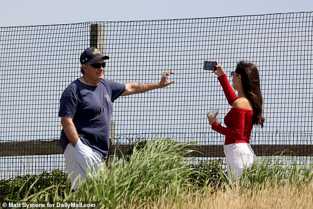 Hudson took photographs of Belichick as he posed at a hilltop viewpoint on the elite Massachusetts island on the Fourth of July