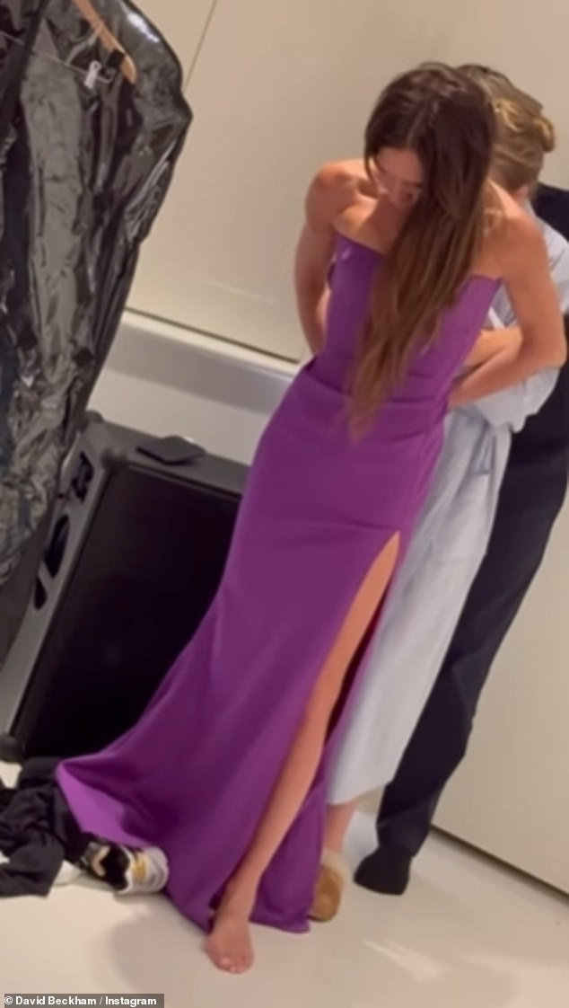 David later shared footage of Victoria trying on her dress, with daughter Harper and close friend Ken Paves' help