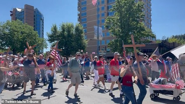 Those who attended the Independence Day parade in Coeur d¿Alene in the deep red state could be seen proudly waving crosses alongside the star spangled banner