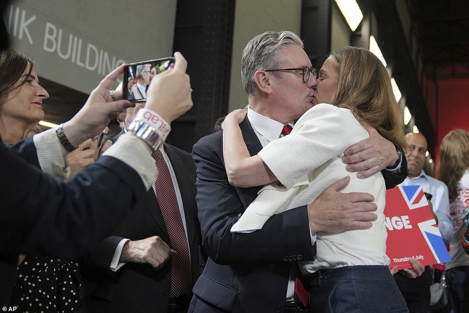 Sealing his triumph by embracing wife Victoria, Keir Starmer said the British people had 'voted to turn the page' on 14 years of Conservative rule - and delivered a riposte to his critics saying there was 'nothing inevitable' about the outcome