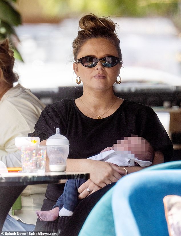 New mum Emily Atack, 34,  has been seen for the first time with her baby son Barney as she and boyfriend Alistair Garner enjoyed lunch as a family in North London on Friday