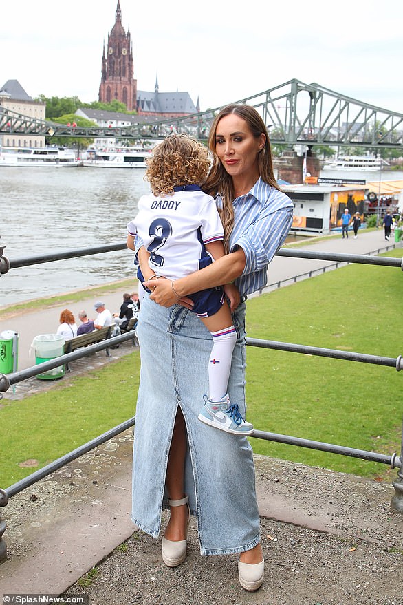 WAGs that have travelled to Germany include Kyle Walker 's wife Annie Kilner and - controversially - his former lover Lauryn Goodman (seen posing with their son, Kairo)