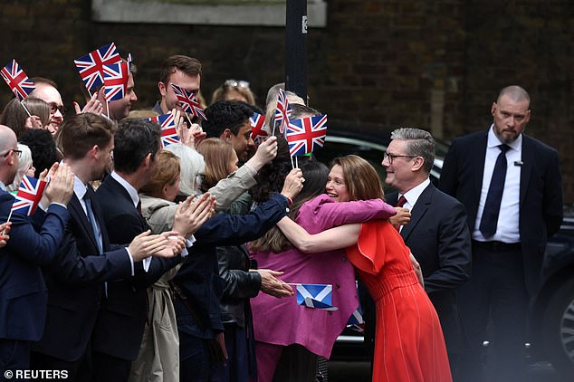 Victoria Starmer hugged jubilant activists this afternoon after Sir Keir was formally installed as Britain's 58th PM