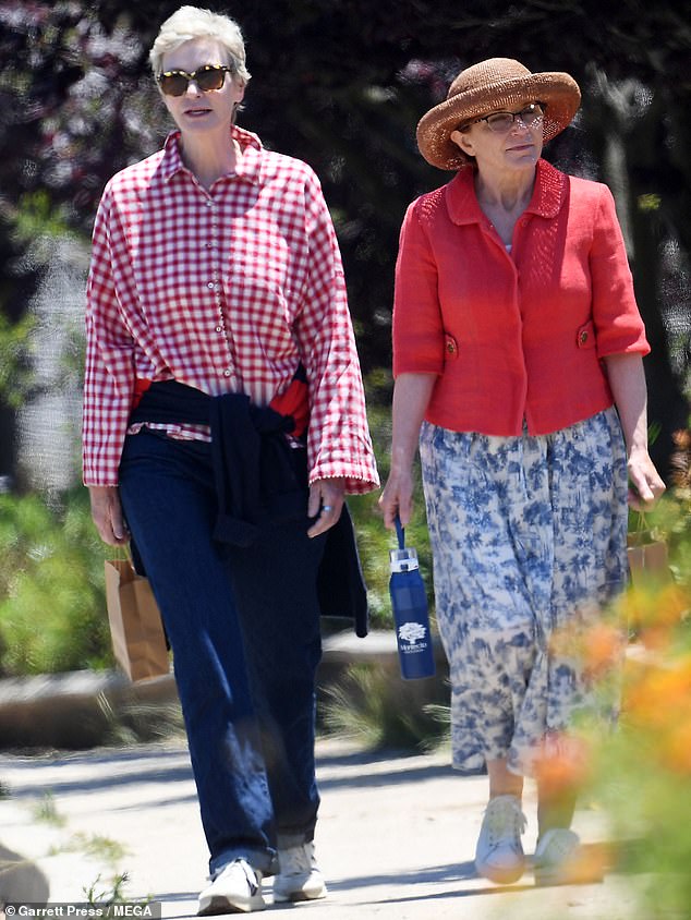 Jane Lynch, 63, donned patriotic colors alongside wife, Jennifer Cheyne, as the pair attended the Montecito Fourth of July Parade in Santa Barbara on Thursday