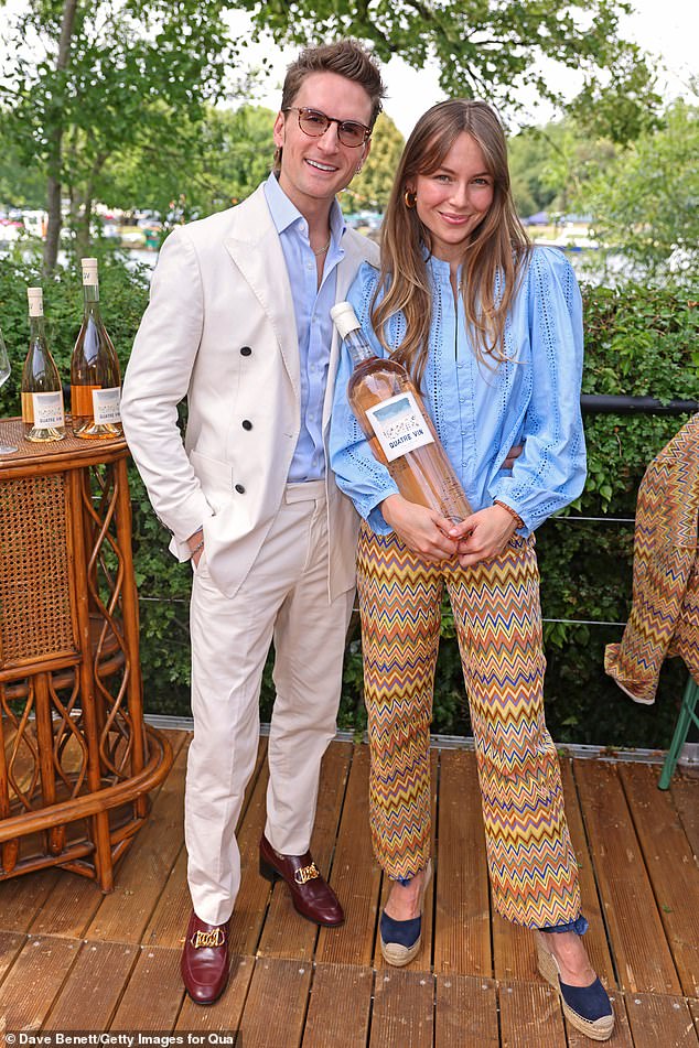 Meanwhile Proudlock looked dapper in a white double-breasted suit