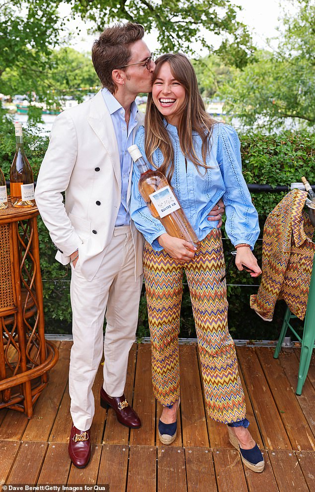 Emma Louise Connolly and Oliver Proudlock packed on the PDA as they stepped out for the Quatre Vin x Hidden Garden Party in Henley-on-Thames on Friday