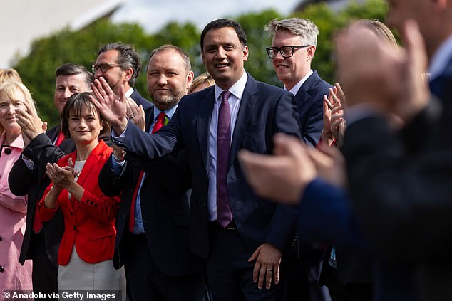 Scottish Labour leader Anas Sarwar poses for photographs in Glasgow with newly-elected MPs following the general election