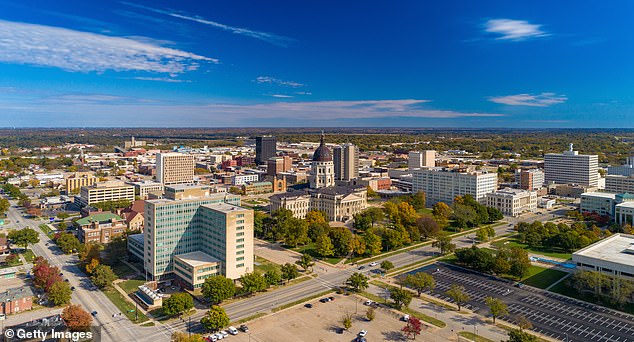 While those looking to spend their retirement in Kansas, state capital Topeka is seen here, could expect their savings to see almost 20 years