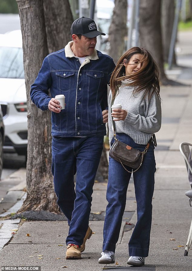 Ada, who plays Leah Patterson on the soap opera, cut a stylish figure in a grey turtleneck jumper and blue straight leg jeans