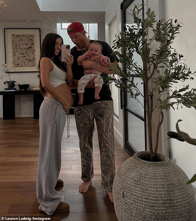 Previously, the Hunger Games star and his wife made the announcement and revealed they were expecting 'new baby Ludwig' in March. In a photo, the pair posed in front of a mirror with Lauren snapping the selfie and Alexander holding their daughter Leni, who was 10-months-old at the time