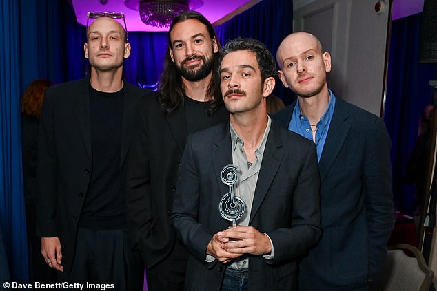 Matty and his band The 1975 scooped the award for Best Group at the Nordoff and Robbins O2 Silver Clefs (L-R George Daniel, Ross MacDonald, Matty and Adam Hann)